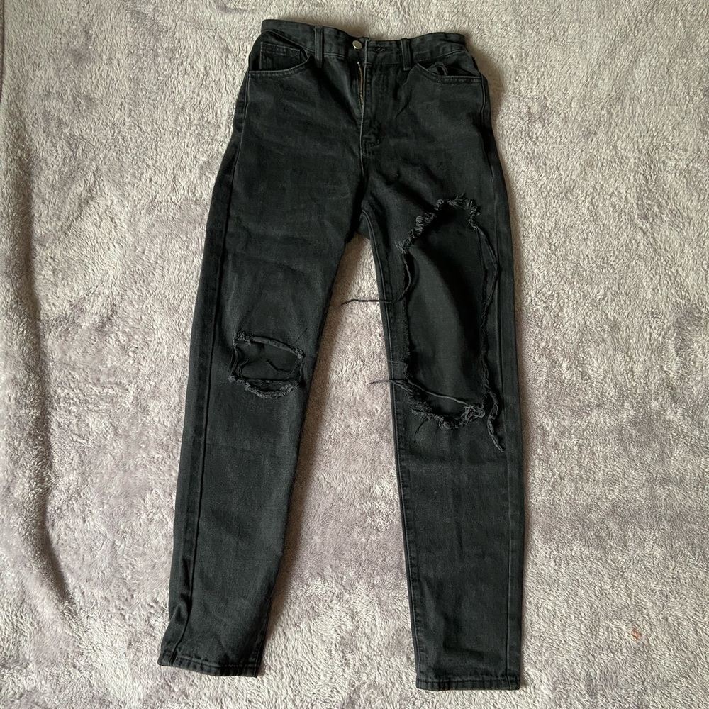 Black ripped jeans.